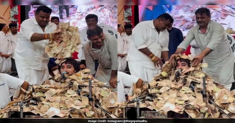 নোট বৃষ্টিতে চাপা পড়ল গায়ক,‘ভিডিও ভাইরাল’